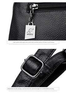Detail of silver kangaroo logo zipper and pebble leather texture on women backpack
