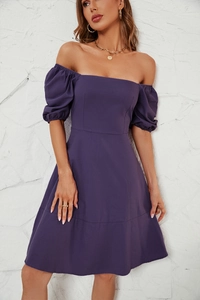 Close-up of deep purple puff sleeves and elegant square neckline on a summer dress