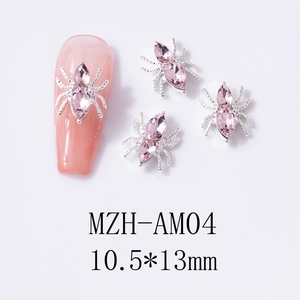 Detail of pink crystal spider nail charm on a long manicured nail with 10.5x13mm dimensions