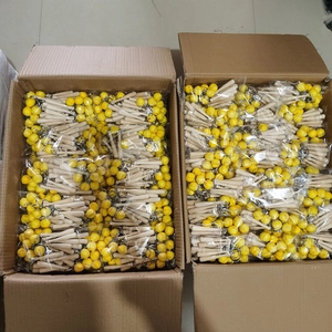 Bulk packaging of mini wooden baseball bat and yellow softball keychains in boxes