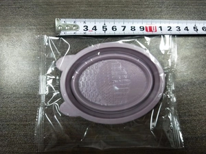 Macro view of purple silicone makeup brush cleaning bowl with cat ears and dimensions
