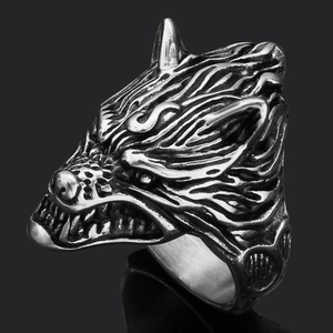 Macro shot of retro stainless steel wolf head ring with vintage oxidized finish and detail