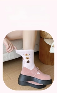 Detailed embroidery of three cute cartoon bears on a pink knit mid-calf cotton sock