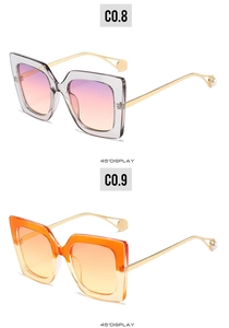 45-degree side view of colorful square sunglasses with golden metal temples and pearls