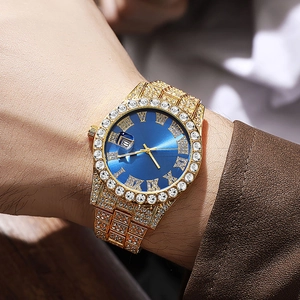 Detailed macro of a luxury gold diamond-set watch featuring a blue Roman numeral dial
