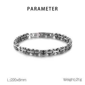 Close-up of silver and gunmetal stainless steel bracelet with anchor icons and dimensions