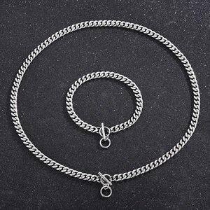 Silver stainless steel Cuban link necklace and bracelet set with OT toggle clasp on black base