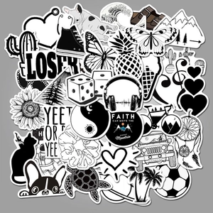 Detailed pile of black and white aesthetic stickers with cactus and mountain patterns