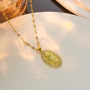 Golden necklace with Virgin Mary heart pendant and sparkling zircon accents in warm lighting