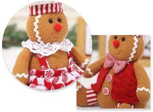Detail of Christmas gingerbread plush doll showing lace collar and knit vest textures