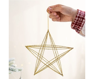 Detail of hand-held gold glittery wireframe star ornament for Christmas tree decor