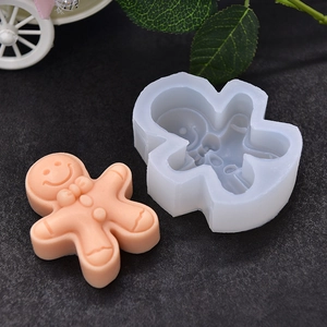 Gingerbread man silicone mold for DIY baking and cakes with a finished orange sample