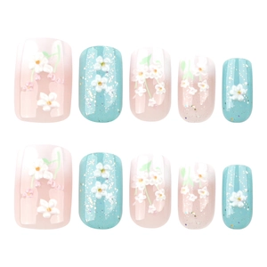 3D floral press-on nails with pink and blue gradient and white embossed flowers