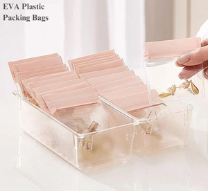Thickened transparent EVA jewelry storage bags with pink zip seal in acrylic box