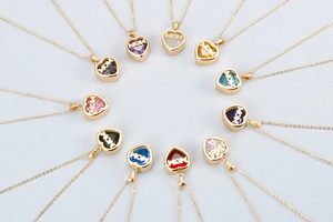 Golden heart necklaces with MOM engraving and colorful birthstones in circular arrangement