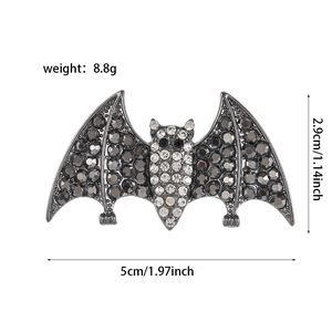 Detail view of gothic bat brooch with dimensions 5cm x 2.9cm and rhinestone embellishments