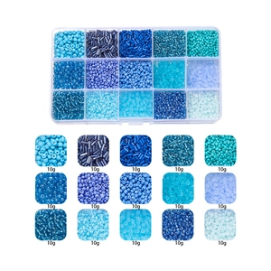 Macro detail of 15-grid blue glass seed beads set for DIY jewelry making kits