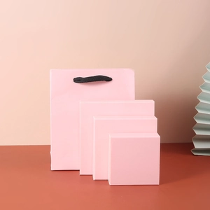 Pink PE film jewelry display boxes with matching paper gift bag in tiered layout
