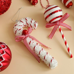 Christmas tree hanging ornaments with red and white candy canes and glitter lollipops