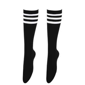 Detail of black knee-high socks with three white stripes in a classic sporty athletic style