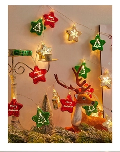 Close-up of LED star string lights with Merry Christmas patterns for festive decoration