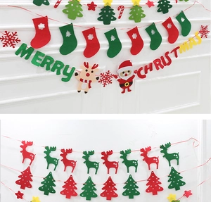 Detail of red and green Christmas felt banners with reindeer and Santa Claus shapes