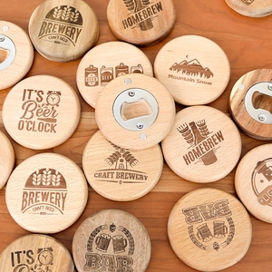 Magnetic wooden beer bottle openers with engraved craft brewery designs on a table