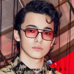 Close-up of double bridge square sunglasses with pink gradient lenses on male model