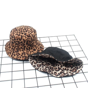 Detail of reversible leopard print bucket hat showing fabric texture and neat stitching