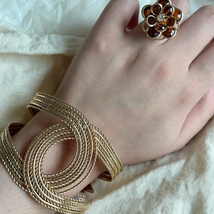 Vintage gold braided cuff bracelet and brown floral ring set worn on model