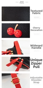 Detail view of lychee pattern leather handbag with rhinestone cherry and red handle