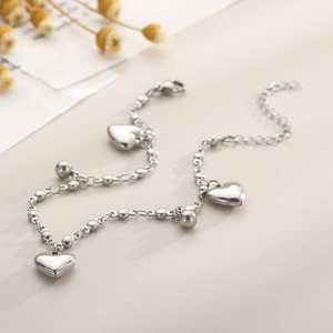 Elegant silver titanium steel anklet with polished heart pendants and round beads