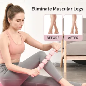 Pink foam roller stick with four massage balls for leg muscle recovery and stretching