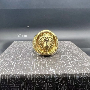 Detail view of gold-plated lion head ring with 21mm height measurement guide