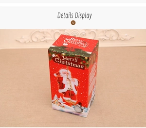 Detailansicht der roten Merry Christmas Geschenkbox für den kletternden Weihnachtsmann