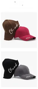 Detail of four colorful ponytail baseball caps with Cloud embroidery and distressed brims