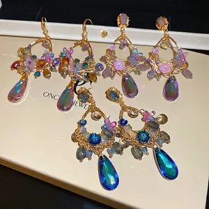Elegant floral drop earrings with colorful waterdrop crystals and butterfly tassel details