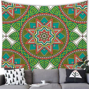 Detail of bohemian mandala tapestry featuring vivid green and orange geometric patterns