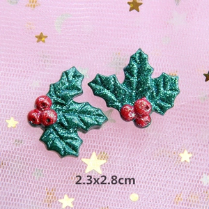 Close-up of glittery holly leaf and berries resin charms for DIY crafts, 2.3x2.8cm size