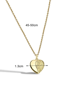 Detail view of gold heart wing pendant showing 1.3cm width and adjustable chain length