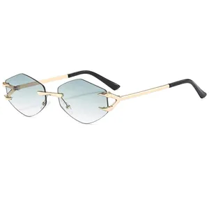 Rimless geometric sunglasses with gradient lenses and gold metal frames shown at 45-degree angle