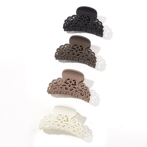 Matte hollow shark hair clips in black, brown, and beige colors for women hair styling