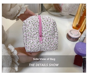 Detailed side view of quilted cotton floral makeup bag with pink flower pattern