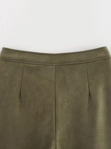 Close-up of olive green faux suede shorts showing high-quality waistband and stitching