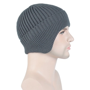 Detail view of grey knit beanie with ear flaps on male model for winter protection