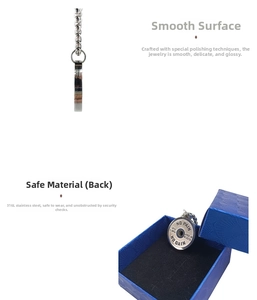 Close-up of barbell weight plate pendant with motivational engraving in a blue gift box