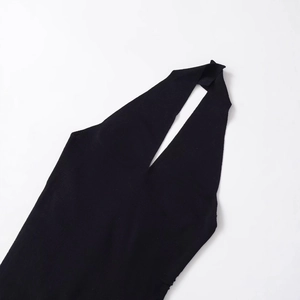 Women's black knit halter neck top with pleated details and sleeveless design