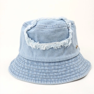 Light blue distressed denim bucket hat with frayed holes and vintage street style texture