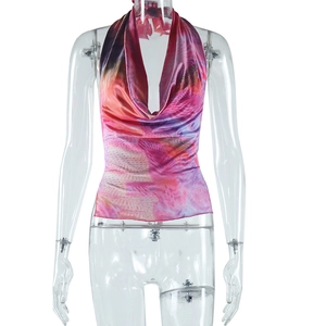 Detail of pink floral halter top with silky satin texture and deep V-neckline design