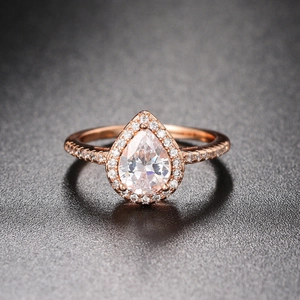 Rose gold pear shaped cubic zirconia double layer wedding ring set on gray background